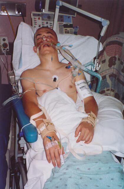 Brady in a hospital bed during his coma