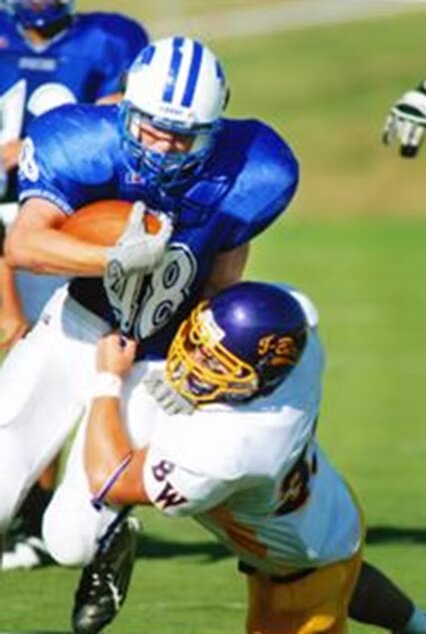 Brady, number 28, carrying the ball